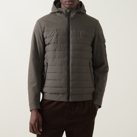 Model wearing Bugatti Dynamic Padded Jacket in olive, featuring quilted front panel, hood, and zip fastening, styled with dark burgundy trousers