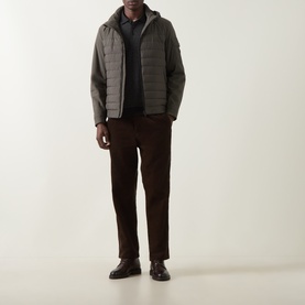 Model wearing Bugatti Dynamic Padded Jacket in olive with dark trousers and brown leather shoes