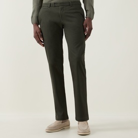 Model wearing Bugatti Micro Flex Slim-Leg Chinos in green, styled with beige loafers and a grey knit jumper.