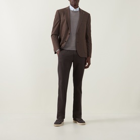 Model wearing Bugatti Micro Flex Slim-Leg Chinos in brown, styled with a matching brown blazer and grey sweater.