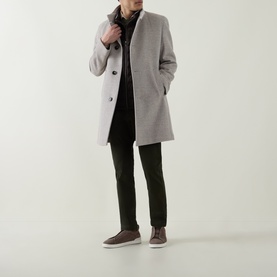 Model wearing Bugatti Logo Longline Coat in stone with stand-up collar and button fastening, styled with dark trousers and scarf.