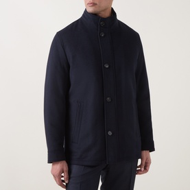 Model wearing Bugatti Short Wool Car Coat in navy, featuring stand collar, button fastening front and slim trousers.
