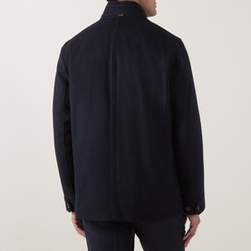 Model wearing Bugatti Short Wool Car Coat in navy, rear view showing stand collar, button tab cuffs and central back seam detail.