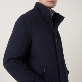Model wearing Bugatti Short Wool Car Coat in navy, featuring stand collar, button fastenings and zipped side pockets.