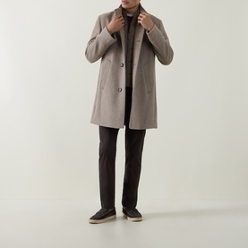 Model wearing Bugatti beige wool-blend coat with button front, styled with dark trousers and slip-on shoes.