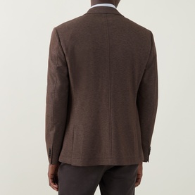 Model wearing Bugatti Birdseye Single-Breasted Blazer in brown, rear view showing notch lapel, tailored seams and rear vents