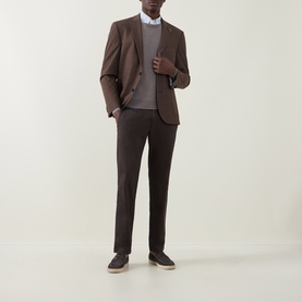 Model wearing Bugatti Birdseye Single-Breasted Blazer in brown, styled with matching brown trousers, grey jumper and white shirt.