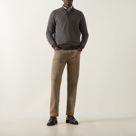 Model wearing Bugatti brown quarter-zip sweatshirt with collared shirt, styled with tan chinos and dark loafers.