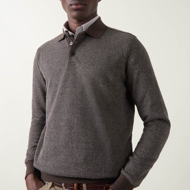 Model wearing Bugatti brown knitted polo sweat with button neck, styled over a collared shirt with chinos.