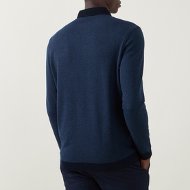 Model wearing Bugatti Textured Polo Shirt in navy blue, back view showing long sleeves, ribbed trims, and straight hem.