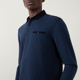 Model wearing Bugatti Textured Polo Shirt in navy blue, showing flat polo collar, three-button placket, and chest welt pocket detail.