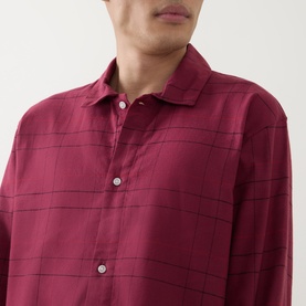 Model wearing Calvin Klein Flannel Check Print Pyjama Set in Established Red, showing point collar shirt with subtle check print and button fastening.