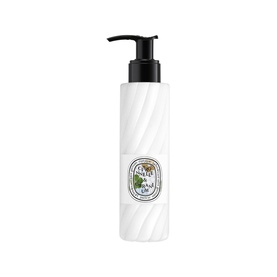 Diptyque hand and body lotion in white ribbed pump bottle with black pump dispenser and oval botanical label.