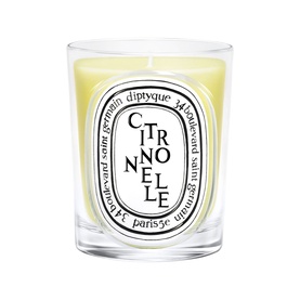 Diptyque Citronnelle scented candle in clear glass vessel with yellow wax and oval label