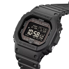 Casio G-Shock digital watch in black, square case with resin strap, digital display showing time and date