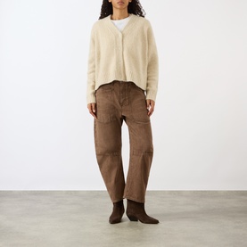 Model wearing Nili Lotan Beige Melange cardigan with brown cargo trousers and brown ankle boots.