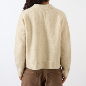 Model wearing Nili Lotan Beige Melange cardigan, back view, styled with brown trousers