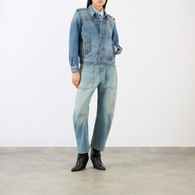 Model wearing Nili Lotan Rosebowl Wash denim jacket, styled with patchwork wide-leg jeans and black ankle boots.