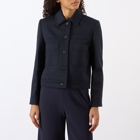 Model wearing Nili Lotan midnight jacket with four patch pockets and button front, styled with matching wide-leg trousers.