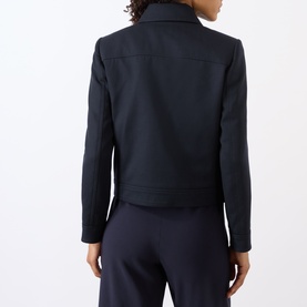 Model wearing Nili Lotan midnight jacket, rear view, paired with matching midnight wide-leg trousers.