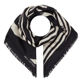 Nili Lotan scarf in zebra print, black and cream stripe pattern with frayed edges, styled knotted flat lay