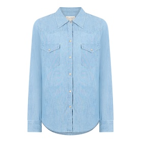 Nili Lotan indigo chambray shirt with chest patch pockets, gold-tone snap buttons, and curved hem. Long sleeves, relaxed fit.