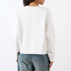 Model wearing Nili Lotan Gladys Sweatshirt in ecru, back view, crew neck, dropped shoulders, styled with light wash jeans.