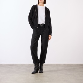Model wearing Nili Lotan carbon cotton trousers, styled with black zip-up hoodie, white tee and black ankle boots