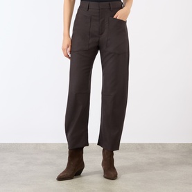 Model wearing Nili Lotan Brown Herringbone wool trousers with straight-leg fit and front pockets, styled with brown ankle boots.