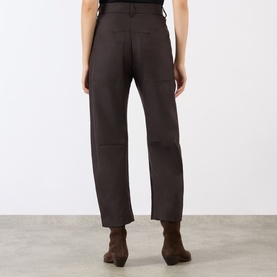 Model wearing Nili Lotan Brown Herringbone wool trousers, back view, styled with brown ankle boots