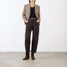 Model wearing Nili Lotan Brown Herringbone wool trousers, styled with a black top, beige blazer, and brown suede ankle boots.