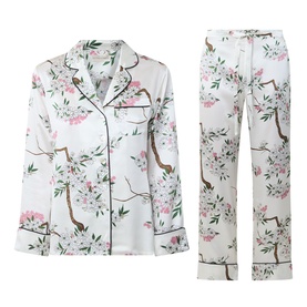 Olivia von Halle Lila Ana Blossom Pyjama Set in white silk with pink floral blossom print, long-sleeve shirt and full-length trousers
