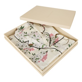 Olivia von Halle Lila Ana Blossom Silk Pyjama Set in cream with pink floral print, folded and presented in a gift box.