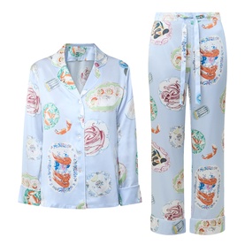 Olivia von Halle Lila Cadiz Seafood Pyjamas in light blue silk with all-over seafood print, long sleeves, button front top and drawstring trousers