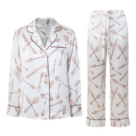 Olivia von Halle Lila Sevilla Silverware Pyjama Set in white silk with allover cutlery print and burgundy piping trim, long sleeve shirt and trousers