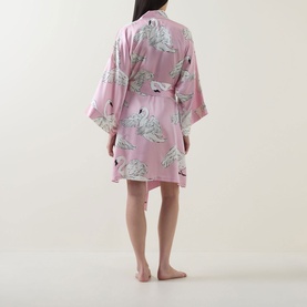 Model wearing Olivia von Halle Mimi Selene Swan Robe in pink silk with swan print, three-quarter sleeves and self-tie belt, back view
