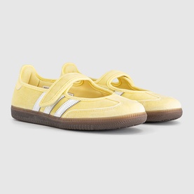Adidas trainers in Care Bear Almost Yellow suede with white triple stripes, velcro strap, and gum sole