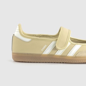 Adidas Samba in dual yellow and white leather with three-stripe detail, velcro strap, and gum rubber sole.