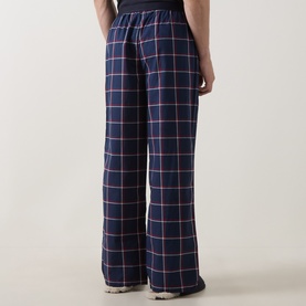 Model wearing Tommy Hilfiger Pyjama Bottom in navy Rwb Windowpane Check, wide-leg cotton fit, elasticated waist, rear view