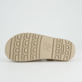 Paul Green women's shoe in brown, sole view showing textured tread pattern with brand logo embossed in beige rubber.