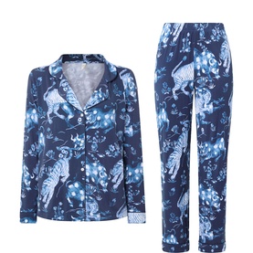 Navy blue pyjama set with white and blue tiger and botanical print, long-sleeve button-up top and matching full-length trousers