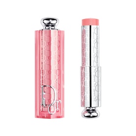 Dior Addict Lip Glow in 106 Pomelo, pink embossed case with silver cap shown open beside bullet