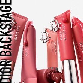 Dior Addict Lip Glow Butter in 106 Pomelo, shown alongside Dior Backstage lip collection in coral and pink shades
