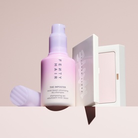 Fenty Hair The Imposter dry shampoo pump bottle in pink-to-lavender ombre, shown with white gift box and silicone scalp brush applicator