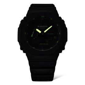 Casio G-Shock black resin watch with octagonal case, neon green luminous hands and markers, and black dial face.