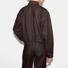 Model wearing Jigsaw burgundy denim jacket, back view, styled with matching wide-leg trousers