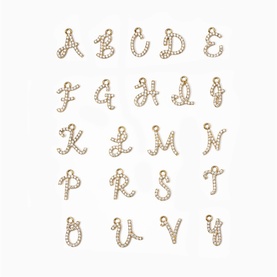 Gold-tone crystal pav&eacute; alphabet letter charms displayed in a grid, each with a small loop, featuring cursive script letters A to V