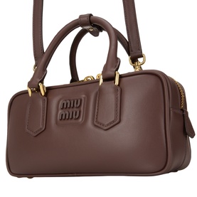 Miu Miu Radica leather crossbody bag with debossed logo, dual top handles and gold-tone hardware, detachable shoulder strap
