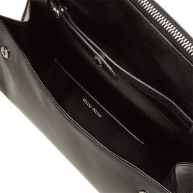 Miu Miu nero calfskin leather crossbody bag, open interior view showing multiple compartments and silver-tone zip