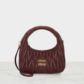 Miu Miu bordeaux matelass&eacute; leather crossbody bag with gold logo hardware, top handle, and detachable shoulder strap